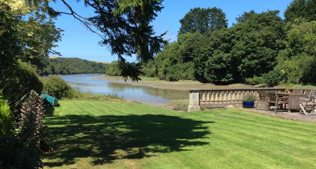 Dine alfresco in the beautiful garden, surrounded by the estuary
